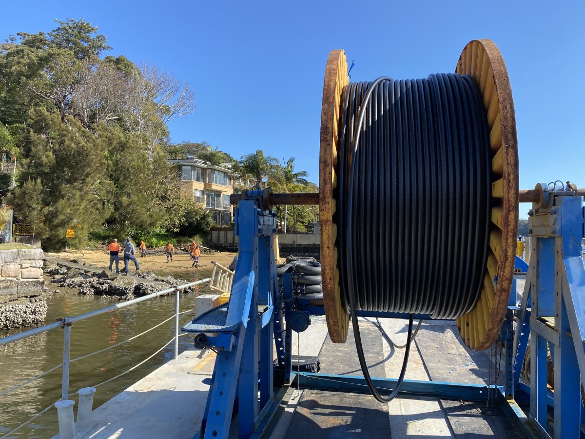 Hauling the submarine cable from the wheel on the barge